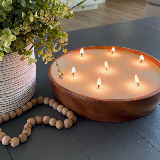 Top view of luxury candle on table in living room.  Lit scented candle on cofee table. 