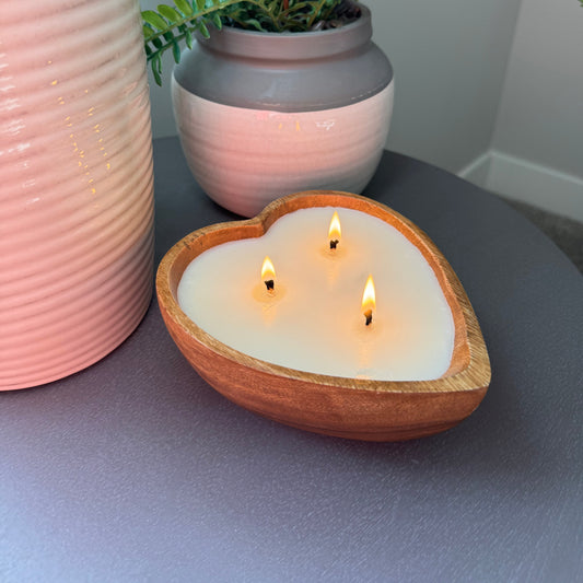 Side view of scented candle on table.  Cozy Wood bowl luxury candle.